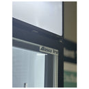 Alaska Line logo on a glass surface with a blurred background